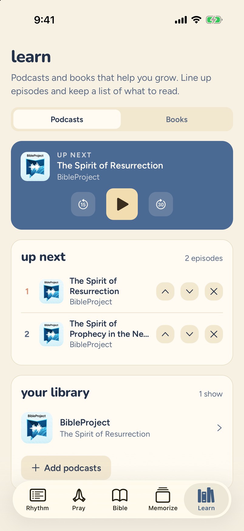 Learn tab with an Up Next podcast queue and a library of shows